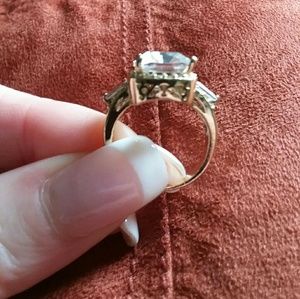 Gold tone ring with clear stone